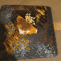 vegan cheesecake with caramel and dark chocolate sauce at Cavo Bistrot in Cagliari