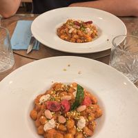 Gnocchi al pesto di pomodori secchi e mandorle, pistacchi e ricotta veg at Cavo Bistrot in Cagliari