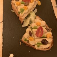 Homemade bread with hummus, olives and veggies at Cavo Bistrot in Cagliari