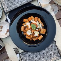 Pasta with tomato sauce, eggplant and vegan ricotta cheese 😋 at Cavo Bistrot in Cagliari