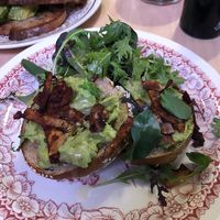 Avocado bagel with coconut facon, rocket  at Origin in Petone