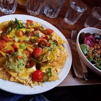 Corn chips with buddah bowl in background at Cosmic Kitchen in Plymouth