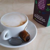 Cappuccino with oat milk and a fresh date. at Klein Geluk Ontbijt in Heemskerk