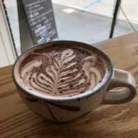 Hot chocolate with oat milk. at Dos Gatos in Johnson City