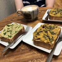 Left is the avocado toast, right are the chickpea salad toasts, and a tea latte with almond milk in the back! at Dos Gatos in Johnson City