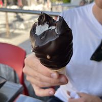 Vegan vanilla soft serve dipped in the dark chocolate (only vegan dip option)  at Chocolats Favoris in Montreal