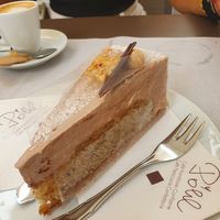 Vegan hazelnut and caramel cake and soy macchiato at Cafè Konditorei Confiserie Pöhl in Merano