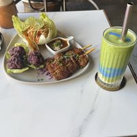 earth smoothie and papaya salad with skewers.  at Vistro in Bangkok
