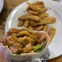 Vegan patty in ‘American Dream’ wrap (ask for no cheese and vegan chipotle sauce) with yummy potato chips  at Schnitz in Ryde