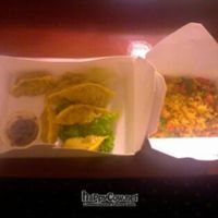 Smiling dumplings and golden rice at Loving Hut in Orlando