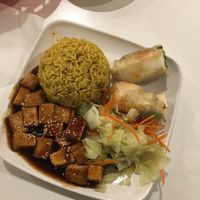 Combo #1 mushroom tofu, yellow rice, and summer rolls. at Loving Hut in Orlando