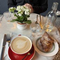 Latte and almond croissant  at Parlé Pantry in West London