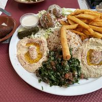 Vegetarian mezze - not vegan by default but can be easily veganized (only non-vegan item is the rolled thing on top of the rice + one yoghurt sauce) at O'Liban in Le Havre