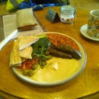 Nothing on this plate is a conventional breakfast, those are not backed beans and those are stuffed vine leaves.

I asked for it to be vegan. at Kassa Coffee  in Hastings