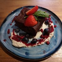 Chocolate brownie with cashew cheese and raspberry coolie at Indigo Greens - Duke St Market in Liverpool