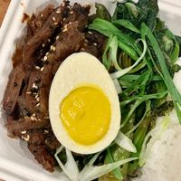 Cha Shao Bowl special - Cantonese style bbq soy curls, Chinese broccoli and vegan poached ‘egg', served with white rice at Foodhisattva in Cleveland Heights