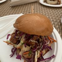 Korean style chicken sandwich with cashew cheesecake in the back  at Modern Times Beer in Santa Barbara