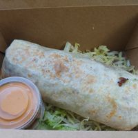 $13.00 Chorizo Burrito 🌯 with Verde sauce: Amazing, my partner's favorite burrito ever and he's tried almost every burrito available. I found the spice kept building and became  at Modern Times Beer in Santa Barbara