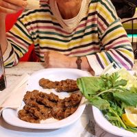 So good, it's already half eaten. Don't forget the pomegranate sauce! at Battalbey Cig Kofte in Karahayit