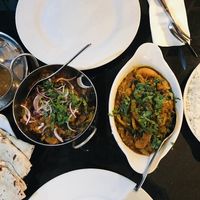 Vegan dishes with rice, bread and dips at Maharaja Indian Cuisine in Chipping Campden