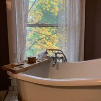 Clawfoot tub with bath amenities in Heather room - be careful, no shower curtain at Old Caledonian Bed & Breakfast in Caledonia