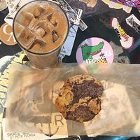 Vegan chocolate chunk cookie and caramel knowledge iced latte with almond milk  at Black Crow Coffee Co - 1st Ave in St Petersburg