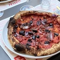 Pizza with olives and onions, delicious but a bit light on the toppings   at Berberè in Verona