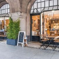 Outdoor seating under arcades and vintage furnitures inside at Fox in Metz