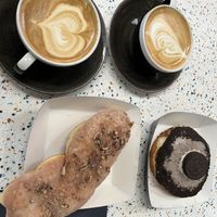 Maple and pecan twist and Oreo donut with oat flat whites  at WHO CULT in Bridgend