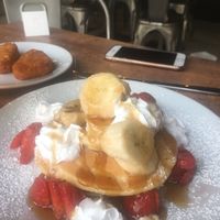 Vegan strawberry and banana pancakes with maple syrup at Stag Coffee in Canterbury