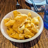 Fried wonton strips which were provided complimentary due to a very long wait for our food. 22 June 2025. at Mudbar in Launceston