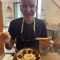 Happy customer and notice how big the portions  at Hummus Bar - Király Utca in Budapest