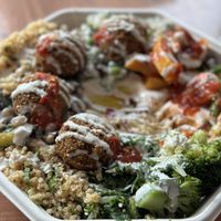 The lunch box, you get light fluffy falafels with an array of salads, plus hummus and bread. The tahini sauce was so delicious too. So good!!!  at Go Falafel in Liverpool