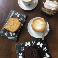 Soy cappuccino and soy vanilla cappuccino. Orange and almond cake. Chocolate and nut cake. at Senso Unico in Olbia
