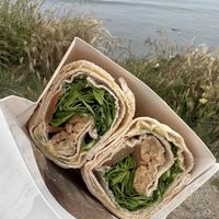 the best f#$@%*! wrap ever (vegan bacon, vegan cream cheese, hummus, tomato, and arugula on lavash bread)  at Isla Vista Food Co-op in Isla Vista