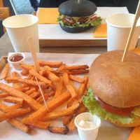 Seitan Burger on top, chickpea one on the bottom. Served with sweet potato fries. at Gourmet Burger in Paris