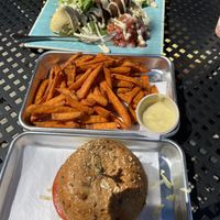 Lentil/ mushroom burger, sweet potato fries and falafel over greens and brown rice with hummus , avocados and pick and tahini   at Turf Surf & Earth in Somerville