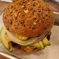 Lentil and Mushroom Double Burgee with Whole Wheat Bun, Cashew Cheese, Onions, Pickels and Avocado at Turf Surf & Earth in Somerville