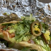Rice and beans fry taco with corn, red onions, and jalapeños  at Hungry Hippie Tacos in Grand Marais