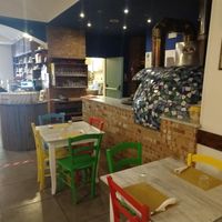 Inside tables with view in kitchen and counter at Un Gelsomino in Salerno