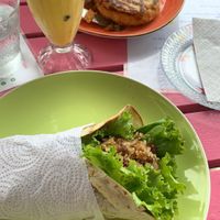 Delicious gallo pinto wrap and salty pancakes with vegan mozzarella and pesto 😋 at Pico Feliz in Samara