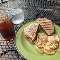 Vegan walnut burger, chips, and an iced coffee. at Brewed Awakenings in Appleton