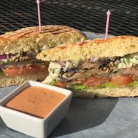 Jalapeño Popper Portabella Burger.
Homemade ciabatta layered with lettuce, tomato, red onion, thick slices of jalapeño crusted portobello mushroom and a vegan jalapeño cream che at Brewed Awakenings in Appleton
