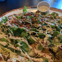 Falafel on flat bread. Tahini sauce at Izz Cafe in Cork