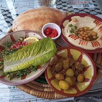 Delicious Hummus, pillowy soft bread, pickles, and Tabbouleh  ❤️💚🖤 at Izz Cafe in Cork