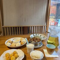The sauce for the buns was condensed milk, but the yogurt is vegan so if you want the buns order the yogurt and dip the breads in it. It was delicious   at A Lotus on the Water 清水荷花 - 文殊坊店 in Chengdu