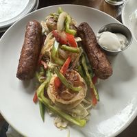 Kielbasa and pierogi on a bed of sweet sauerkraut, with sour cream    at Rowley Inn in Cleveland