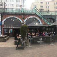 Main building and part of outdoor seating.  Located just below Kings Rd by the sea, near the intersection with West St. at Tempest Inn in Brighton