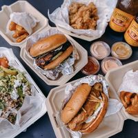 BBQ pulled pork, fried chicken, adobo wings and grandeur salad  at Grandeur in Oakland