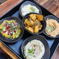 Veggie mezze - usually comes with dolmades, but we got an extra dip instead. Spiced potatoes in the middle   at Damascena Coffee House - Temple Row in Birmingham